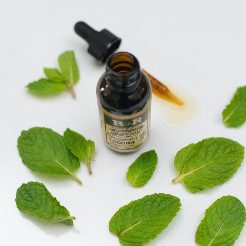 Peppermint Essential Oil with peppermint leaves