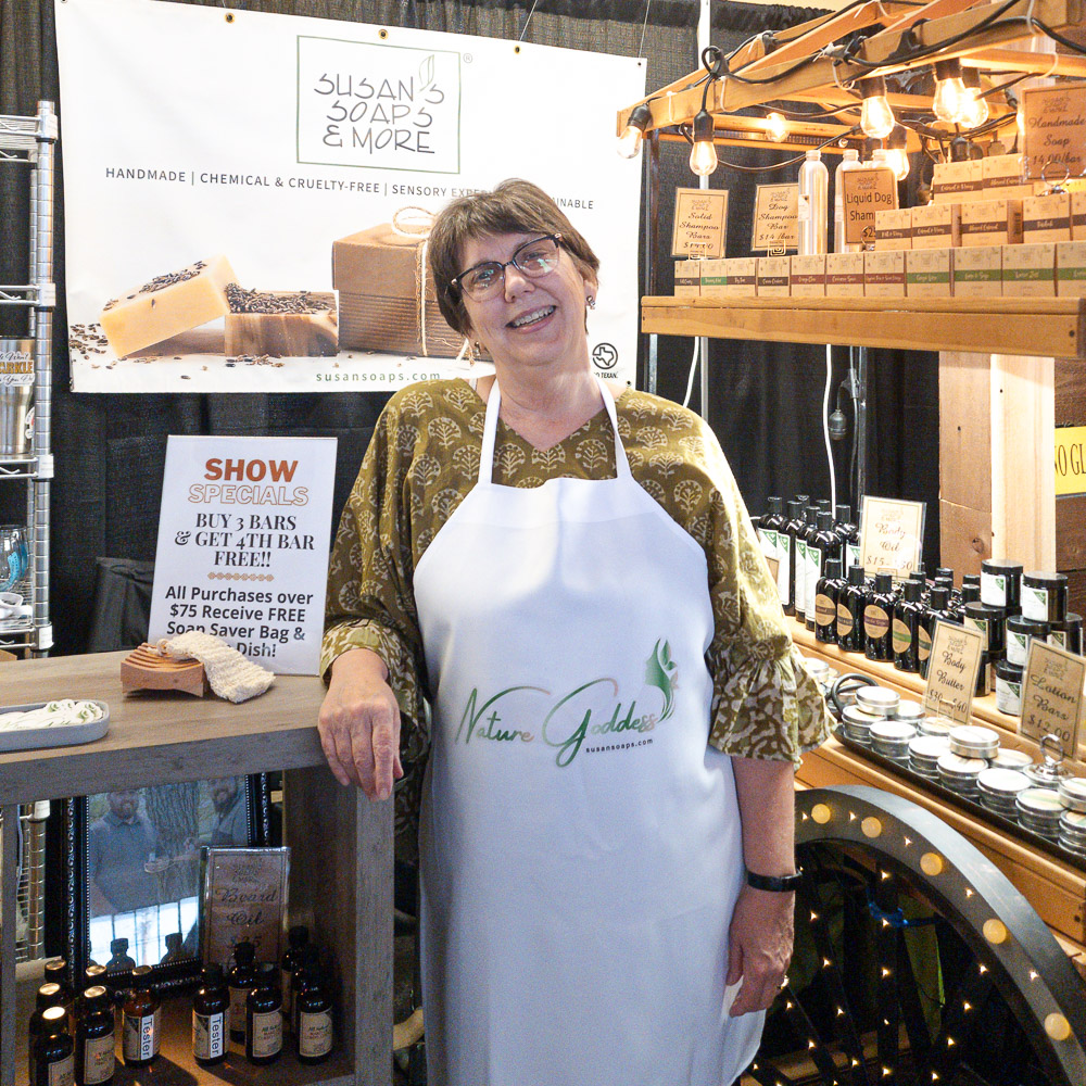 Susan in Fair Booth wearing apron