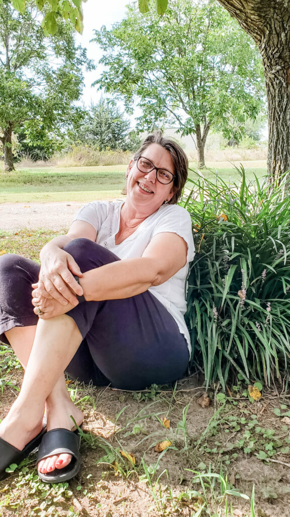 Susan-sitting-by-tree