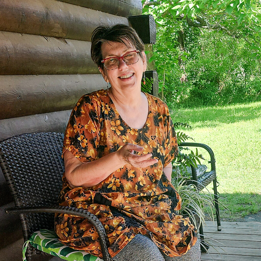 Susan on Back Porch in gold top